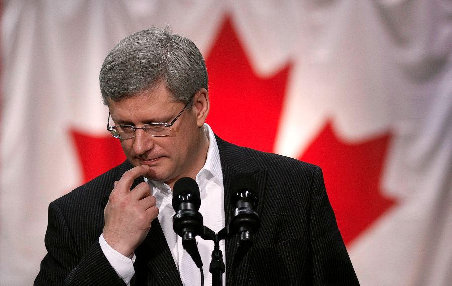 Conservative leader and Canada's Prime Minister Harper pauses while speaking during a campaign stop at an automobile parts factory in Brampton